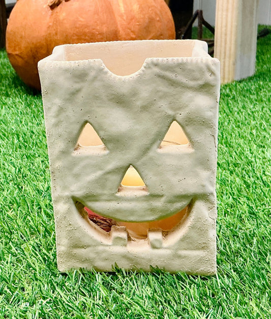 Pair of Ceramic Paper Bag Style Luminaries with Jack-O-Lantern Faces