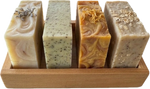 Bamboo cradle tray holding handmade soap bars