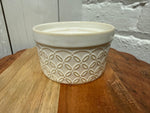 Solid dish soap in an Arctic White ramekin with embossed Botanical Petal pattern