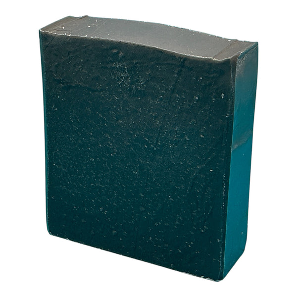 Dr Pine pine tar handcrafted bar soap by Monticello Soap Company, dark rugged bar with charcoal, oatmeal, and sea clay.