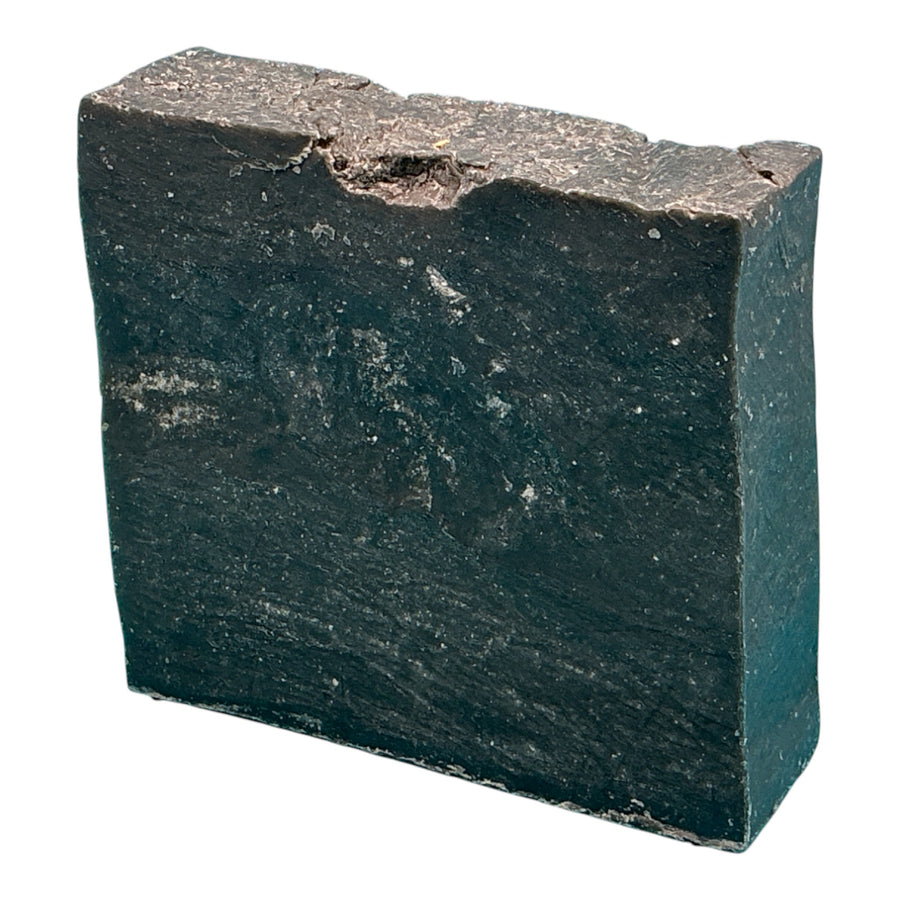 Citrus Jewelweed handcrafted bar soap by Monticello Soap Company, a dark bar with jewelweed, pine tar, and charcoal.