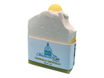 Monticello Limoncello handcrafted bar soap by Monticello Soap Company, sliced bar showing lemon embed on top.