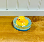 Ducky Soap handcrafted novelty bar by Monticello Soap Company, side view of melt-and-pour bar with rubber duck topper.