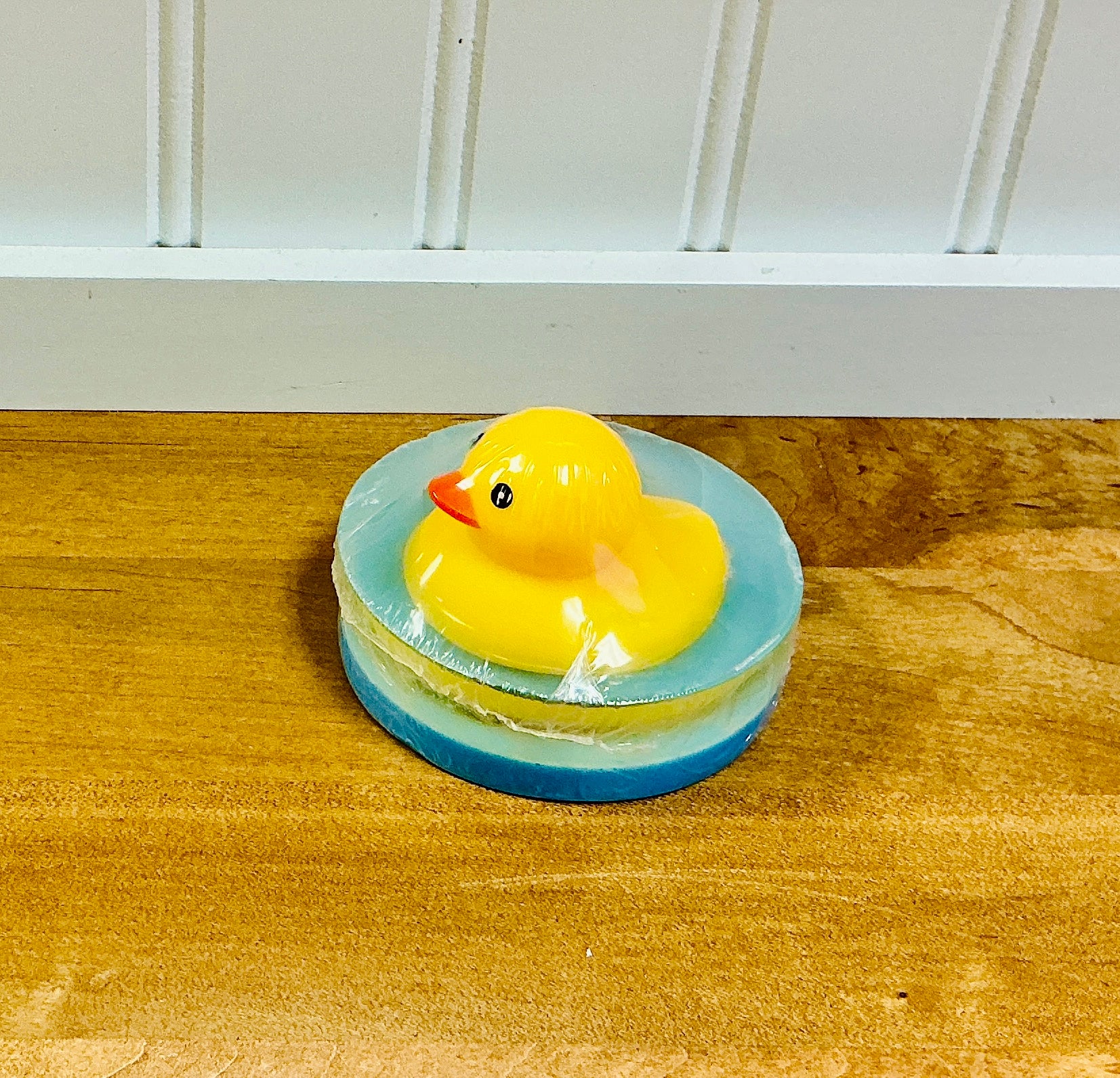 Ducky Soap handcrafted novelty bar by Monticello Soap Company, side view of melt-and-pour bar with rubber duck topper.